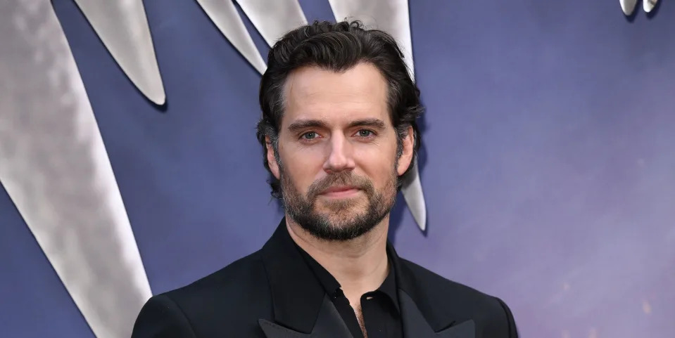 henry cavill at the witcher season 3 premiere in june 2023 in a black suit with a black shirt