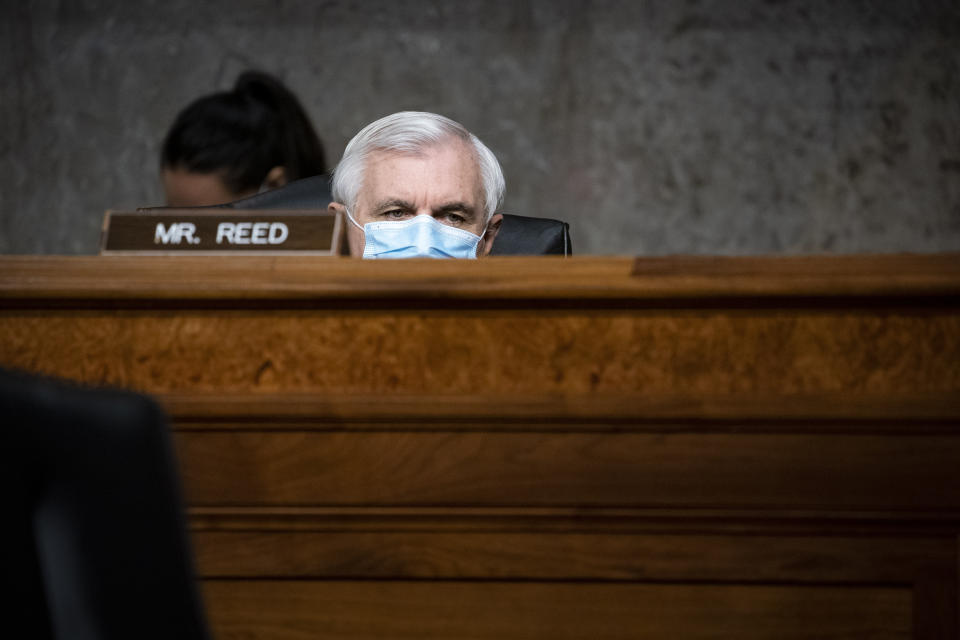 Ranking member Sen. Jack Reed, D-RI., speaks as Kenneth Braithwaite, nominated to be Secretary of the Navy, Gen. Charles Q. Brown, Jr., nominated for reappointment to Chief of Staff of the U.S. Air Force and James Anderson, nominated to be Deputy Under Secretary of Defense for Policy, testify during a Senate Armed Services Committee hearing on Capitol Hill in Washington, Thursday, May 7, 2020. (Al Drago/Pool via AP)