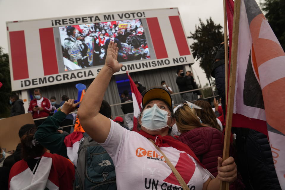 Supporters of presidential candidate Keiko Fujimori gather to protest alleged election fraud in Lima, Peru, Saturday, June 12, 2021. Supporters are hoping to reverse the results of the June 6th presidential runoff election that seem to have given the win to opponent Pedro Castillo amid unproven claims of possible vote tampering. (AP Photo/Martin Mejia)