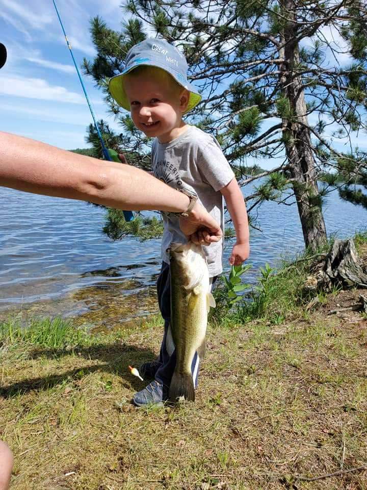 Aaron Manza, son of Judith Manza, fishing at the Reed Ranch in Oscoda County, Michigan.