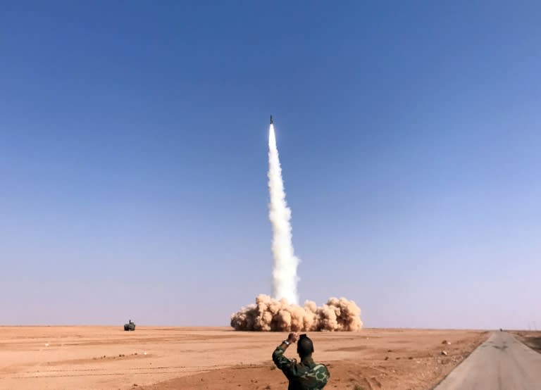 A rocket is fired by Syrian forces near the border town of Albu Kamal on November 10, 2017