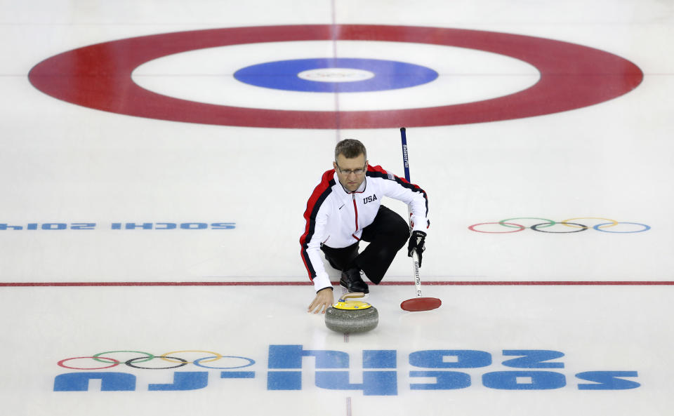 Craig Brown, an alternate on Team USA, delivers the stone during a men's curling training session the 2014 Winter Olympics, Sunday, Feb. 9, 2014, in Sochi, Russia. (AP Photo/Robert F. Bukaty)