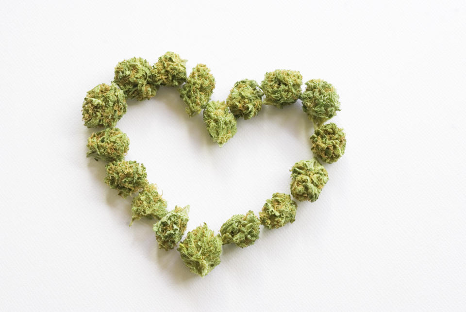 Marijuana buds arranged to make a heart shape