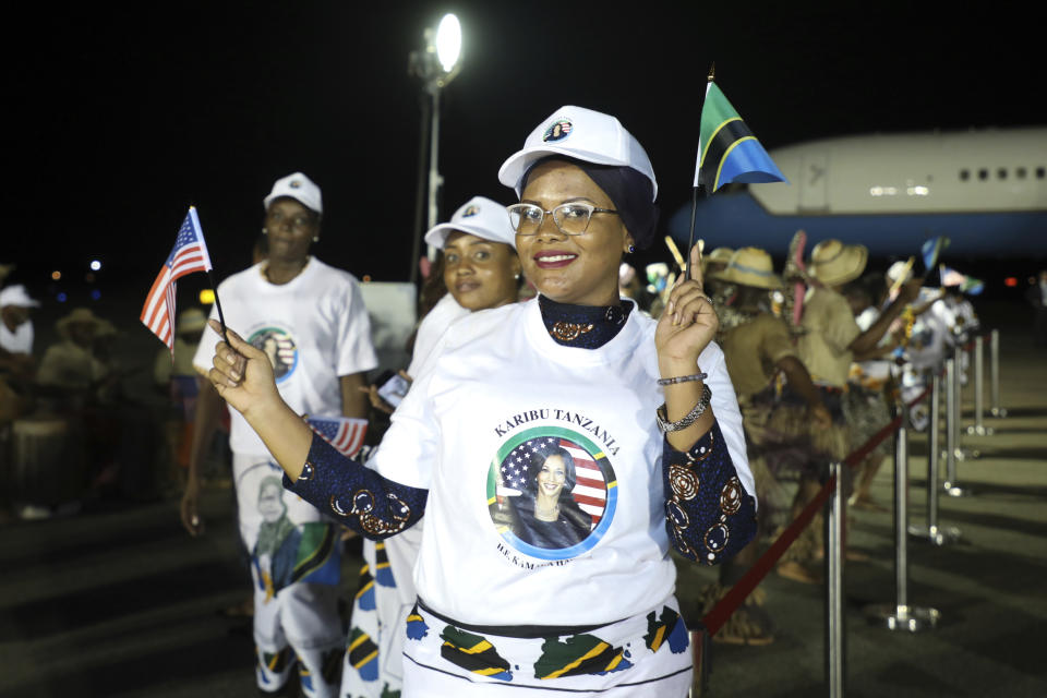 People welcome U.S. Vice President Kamala Harris on her arrival at Julius Nyerere International Airport in Dar es Salaam Wednesday, March 29, 2023. (Ericky Boniphace/Pool Photo via AP)