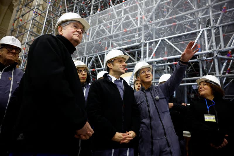 French President Macron visits Paris' Notre-Dame cathedral a year before its reopening