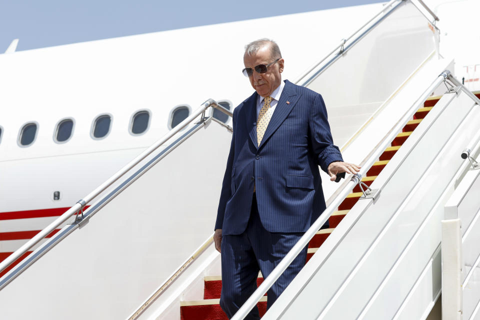 Turkish President Recep Tayyip Erdogan disembarks from an airplane upon his arrival at Baghdad International Airport, in Baghdad, Iraq, Monday April 22, 2024. (Thaier Al-Sudani/Pool via AP)