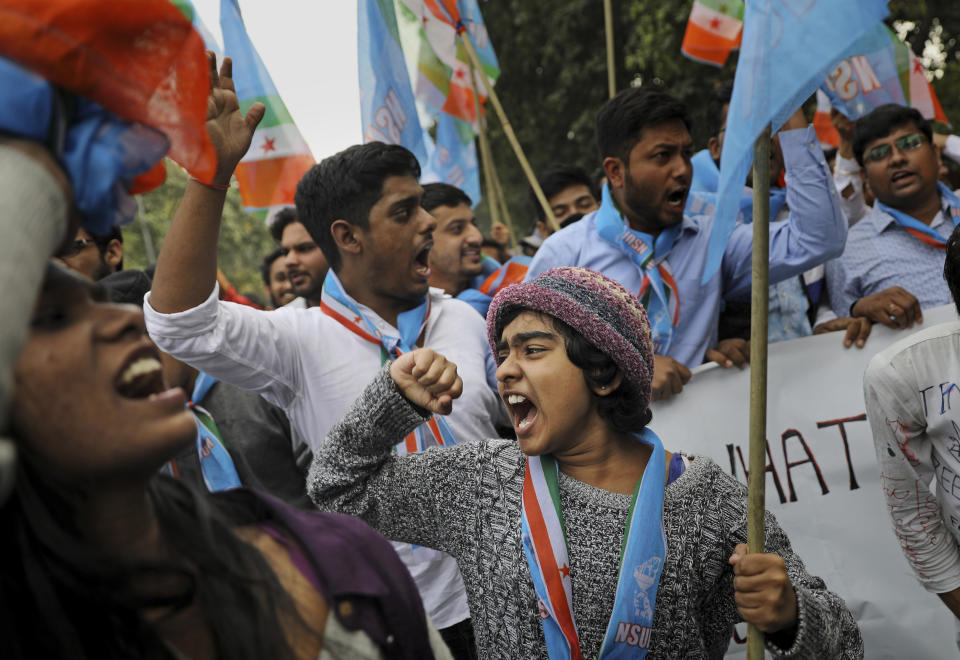 Indian students shout slogans during a protest march towards the Parliament in New Delhi, India, Saturday, Nov. 23, 2019. Hundreds of students of the Jawaharlal Nehru University were joined by students from other universities, activists and members of civil society as they marched towards India's parliament to protest against the hostel fee hike, along with their other demands. (AP Photo/Altaf Qadri)