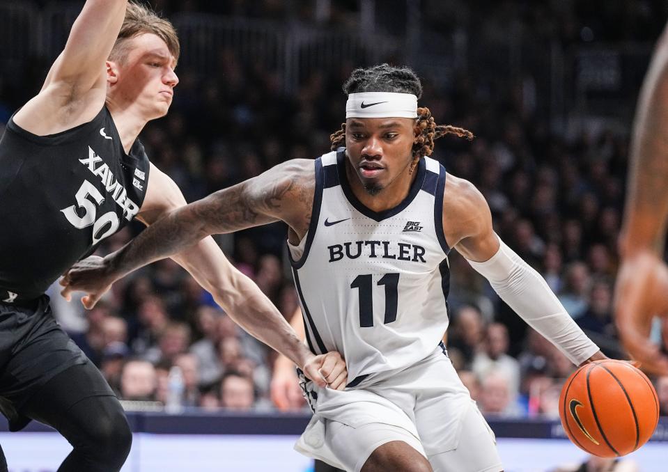 Butler Bulldogs guard Jahmyl Telfort (11) rushes up the curt against Xavier Musketeers forward Gytis Nemeiksa (50) on Wednesday, March 6, 2024, during the game at Hinkle Fieldhouse in Indianapolis. The Butler Bulldogs defeated the Xavier Musketeers, 72-66.