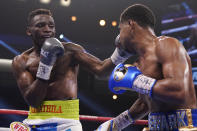 Jeremiah Nakathila, of Namibia, hits Shakur Stevenson in a WBO interim junior lightweight title fight Saturday, June 12, 2021, in Las Vegas. (AP Photo/John Locher)