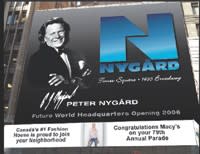 Nygård’s office opening is announced on a Times Square billboard in 2005.