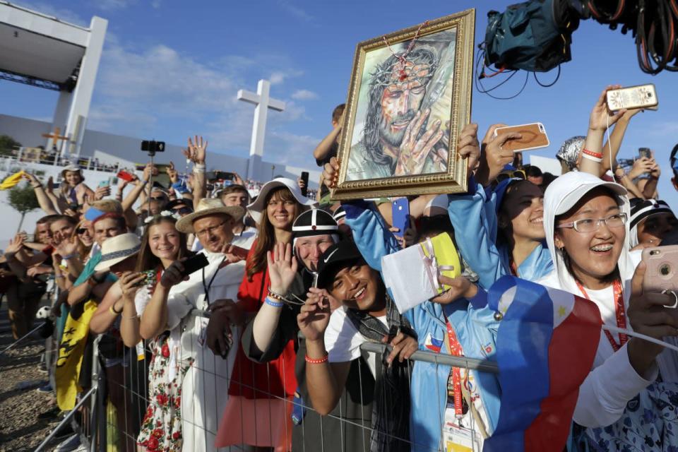 Faithful wait for Pope Francis to arrive for a prayer vigil on the occasion of the World Youth Days, in Campus Misericordiae in Brzegi, near Krakow, Poland, Saturday, July 30, 2016. (AP Photo/Gregorio Borgia)