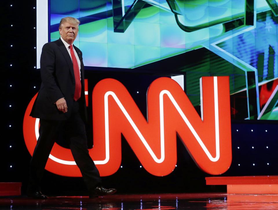 Republican presidential candidate and businessman Donald Trump enters the debate hall during the Republican presidential debate sponsored by CNN, Salem Media Group and the Washington Times at the University of Miami on March 10, 2016, in Coral Gables, Fla. | Alan Diaz, Associated Press