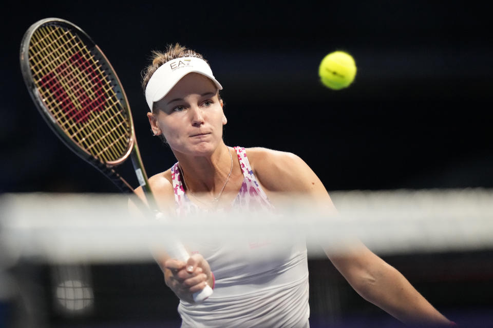 Veronika Kudermetova of Russia makes a volley to Fernanda Contreras Gomez of Mexico during a singles match in the Pan Pacific Open tennis tournament at Ariake Colosseum Thursday, Sept. 22, 2022, in Tokyo. (AP Photo/Shuji Kajiyama)