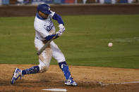 Los Angeles Dodgers' Mookie Betts connects for a solo home run during the ninth inning of the team's baseball game against the Arizona Diamondbacks on Wednesday, Sept. 2, 2020, in Los Angeles. (AP Photo/Marcio Jose Sanchez)