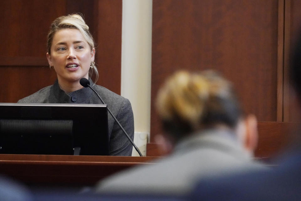 Actor Amber Heard testifies in the courtroom at the Fairfax County Circuit Courthouse in Fairfax, Va., Monday, May 16, 2022. Actor Johnny Depp sued his ex-wife Amber Heard for libel in Fairfax County Circuit Court after she wrote an op-ed piece in The Washington Post in 2018 referring to herself as a "public figure representing domestic abuse." (AP Photo/Steve Helber, Pool)