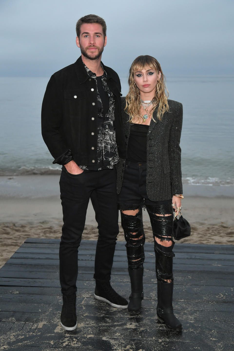 Liam Hemsworth and Miley Cyrus attend the Saint Laurent Mens Spring Summer 20 Show Photo Call on June 06, 2019 in Malibu, California.