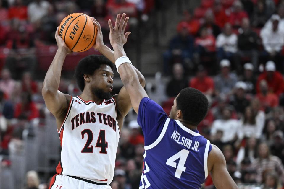 Texas Tech guard Kerwin Walton (24) attempts to pass the ball as TCU guard Jameer Nelson Jr. (4) defends during the first half of an NCAA college basketball game Tuesday, Feb. 20, 2024, in Lubbock, Texas. (AP Photo/Justin Rex)