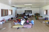 People take shelter at the Apostolic Church of Tagabe in Port Vila on March 20, 2015 after Cyclone Pam devastated Vanuatu