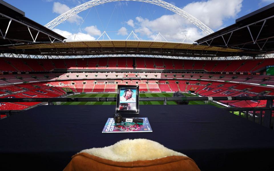 The EFL tribute to John Motson at Wembley stadium ahead of the Carabao Cup Final - Shutterstock