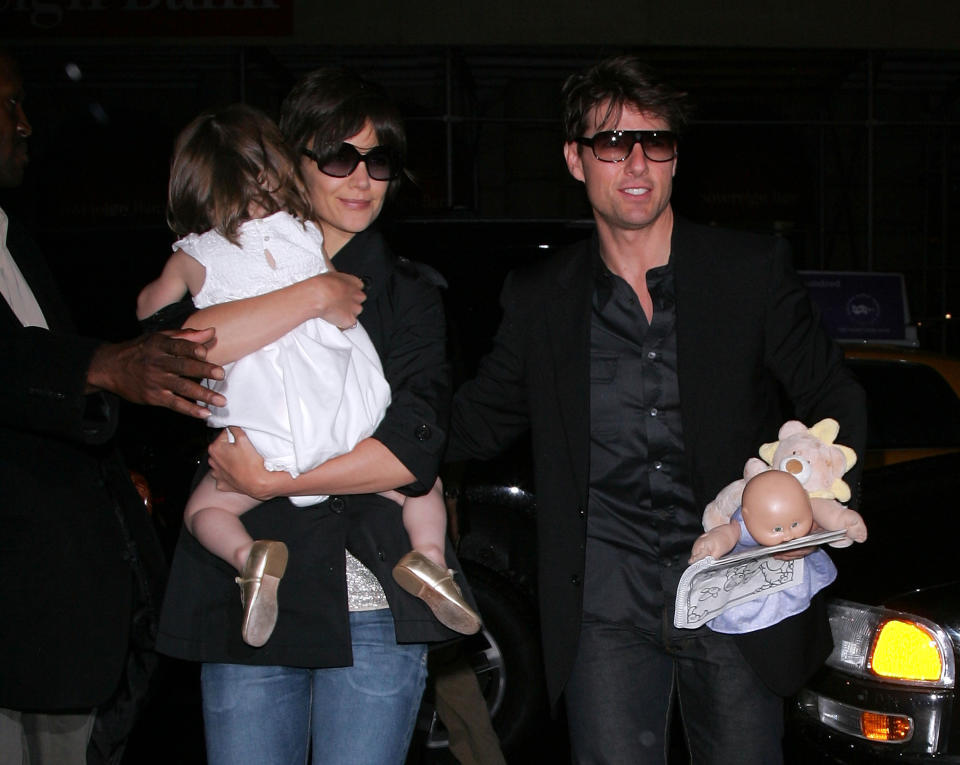 NEW YORK - AUGUST 15:  Katie Holmes, Suri Cruise and Tom Cruise leave Nobu on August 15, 2008 in New York City.  (Photo by James Devaney/WireImage)