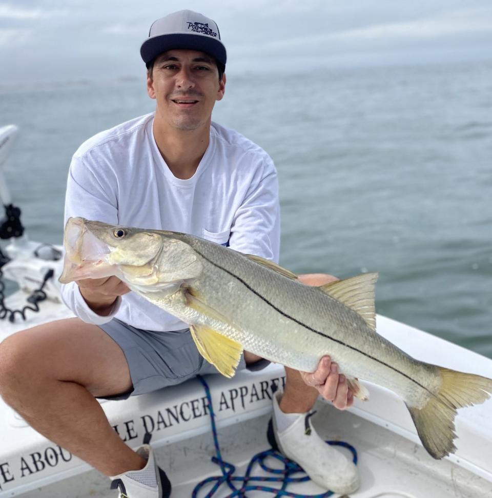 Cole Beynon Jr.,with a 30-inch snook caught aboard the Pole Dancer charter boat with Capt. Jeff Patterson.