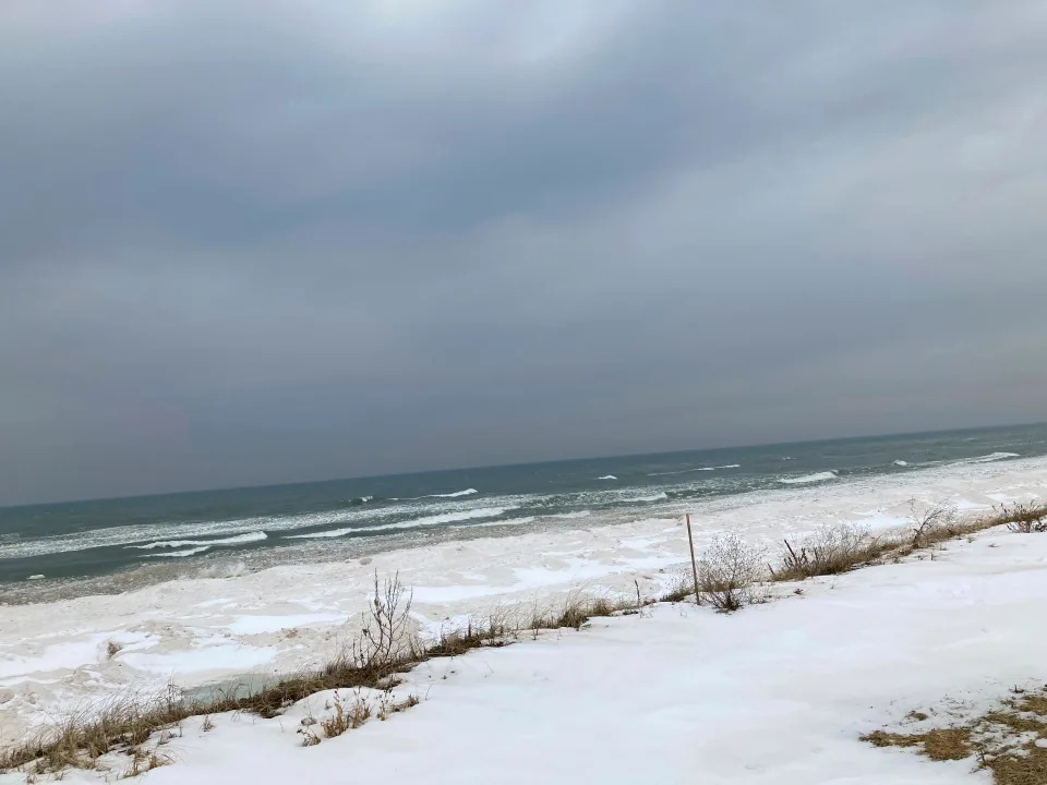 Lake Michigan shoreline in Ottawa County, Mich., is shown on Feb. 1, 2022. Despite its closeness to the lake, the county has areas where household and business wells are running short of water. That's because the aquifer beneath the county has dropped significantly in recent decades and it has no connection to the lake. Experts say Ottawa County is a cautionary tale for the state of Michigan, which is trying to leverage its water abundance to build a "blue economy" as climate change brings more drought and depleted aquifers to much of the U.S.