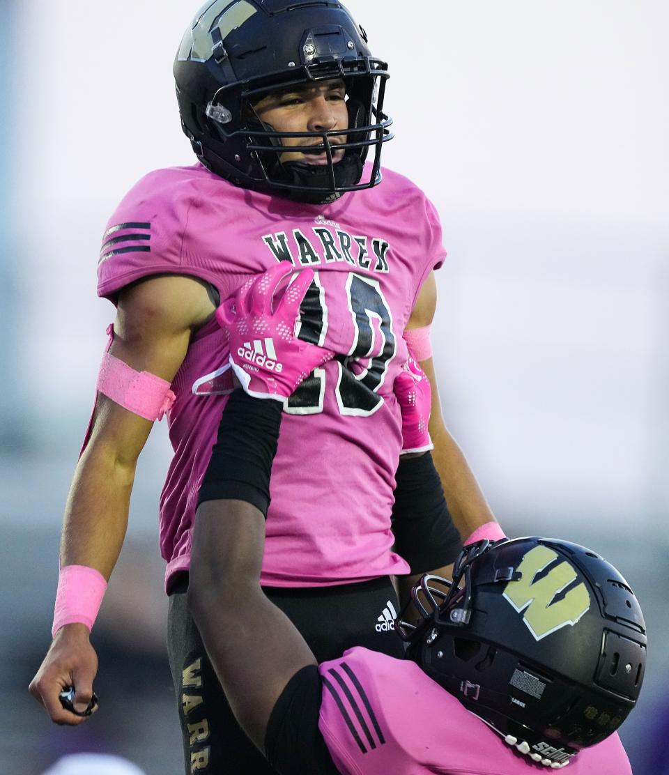 Warren Central Keith Jackson (10) is lifted up in celebration after a touchdown on Friday, September 16, 2022, at Warren Central High School in Indianapolis. The Ben Davis Giants and Warren Central are tied at the half, 21-21. 