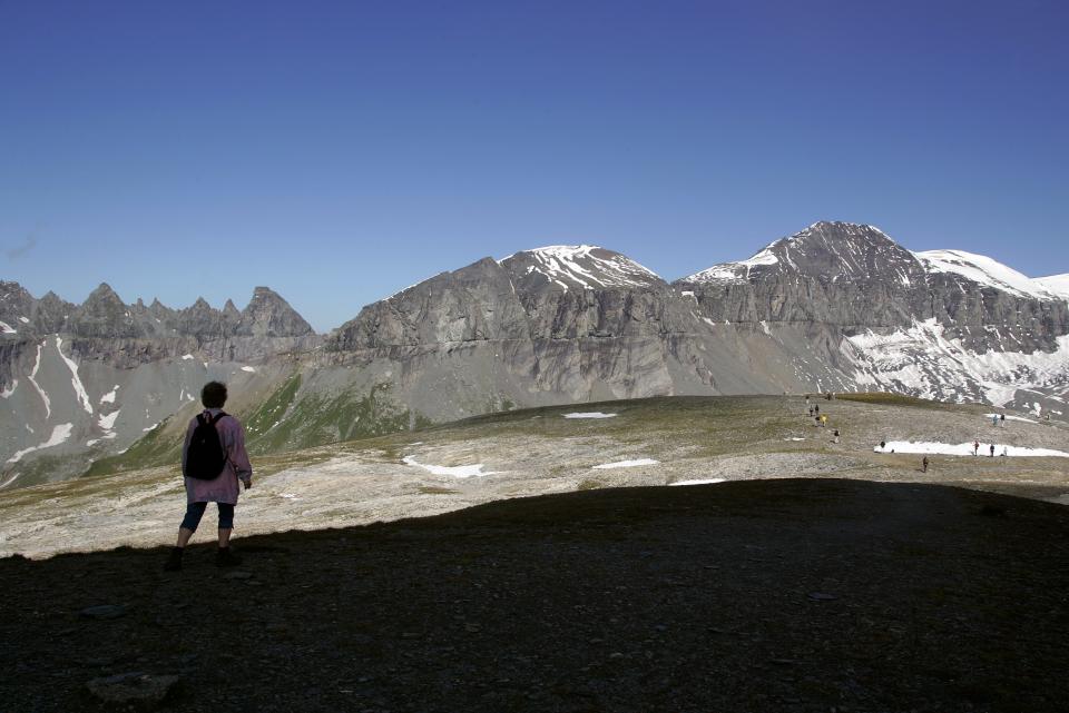 FILE - In this Sept. 1, 2004 photo ,from left, the Tschingel Horn mountains, Atlas ridge and Mount Piz Segnas are pictured in Switzerland. Police in southeastern Graubuenden canton (state) said a several-seater plane crashed Saturday on the Piz Segnas mountain above the Swiss Alpine resort of Flims, striking the mountain's western flank about 2,540 meters (8,330 feet) above sea level. There was no immediate word on casualties. (Arno Balzarini/Keystone via AP, file)