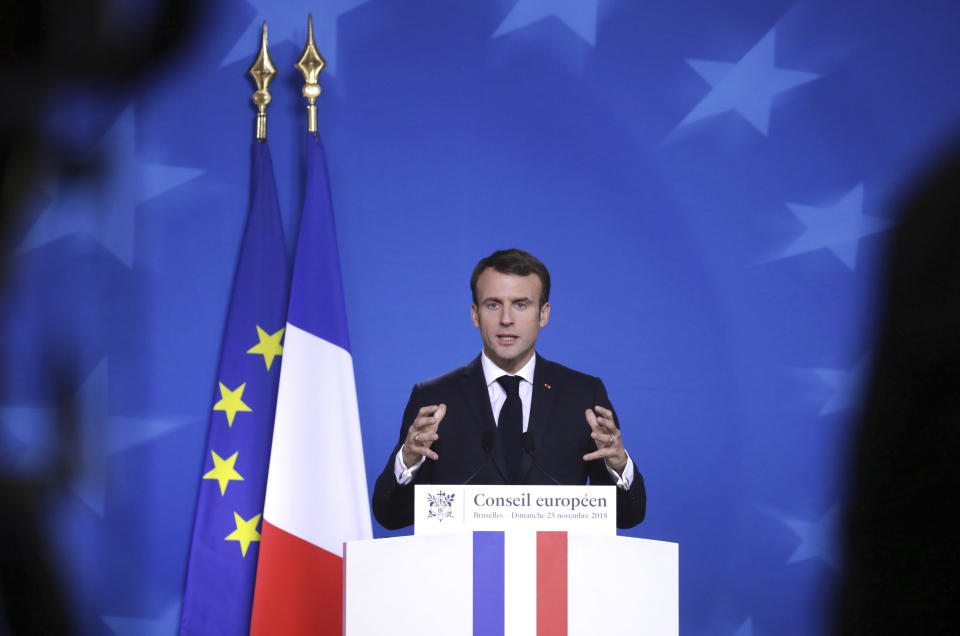 French President Emmanuel Macron speaks during a media conference at the conclusion of an EU summit in Brussels, Sunday, Nov. 25, 2018. European Union gathered Sunday to seal an agreement on Britain's departure from the bloc next year, the first time a member country will have left the 28-nation bloc. (AP Photo/Olivier Matthys)