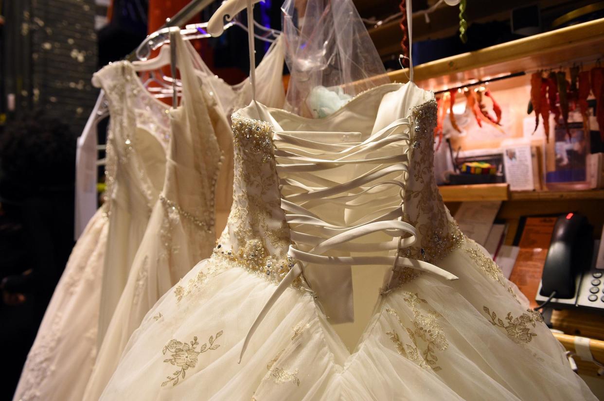 Wedding dresses at the 2016 Alfred Angelo Disney Fairy Tale Weddings Bridal Collection fashion show: Bryan Bedder/Getty Images for Alfred Angelo