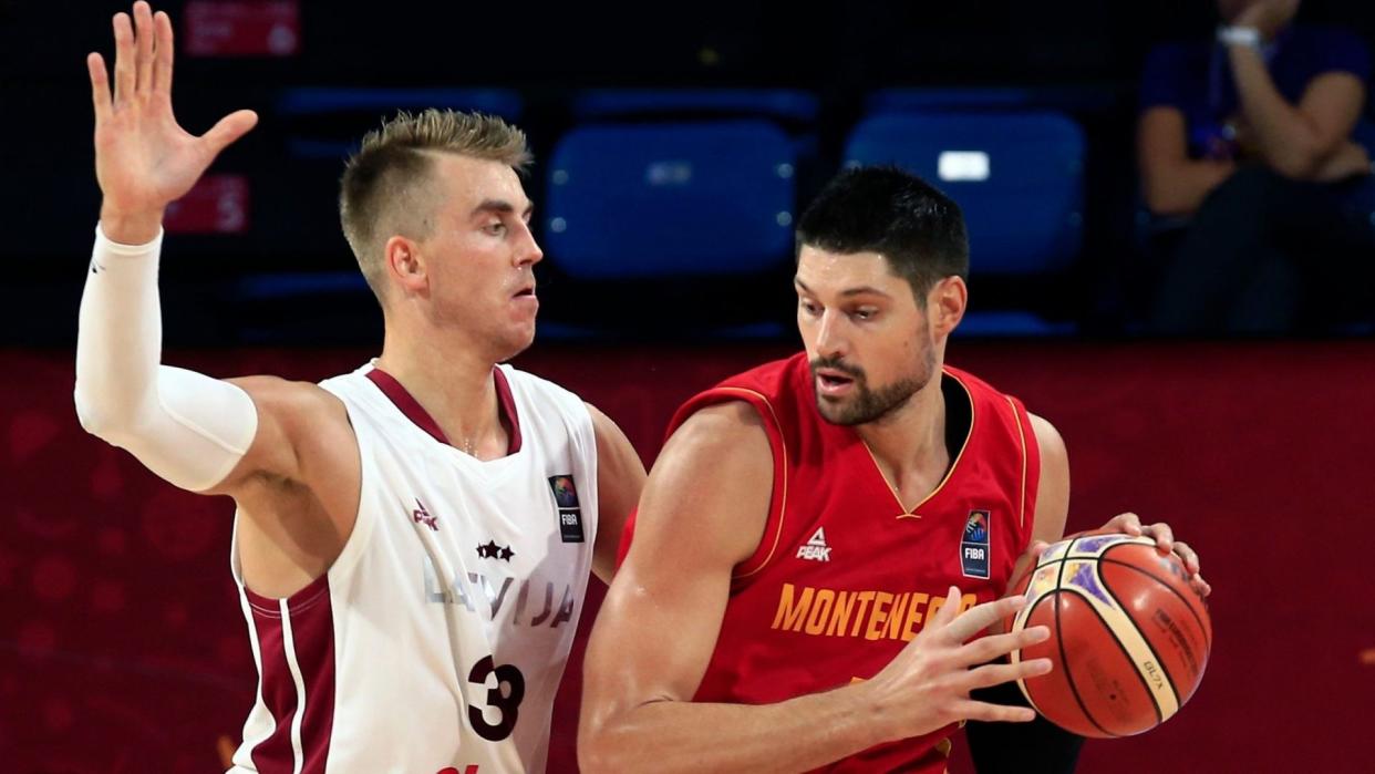 Mandatory Credit: Photo by AP/Shutterstock (9049130m)Montenegro's Nikola Vucevic, right, drives to the basket as Latvia's Martins Meiers tries to block him during their Eurobasket European Basketball Championship round of 16 match in Istanbul, Sunday, Sept.