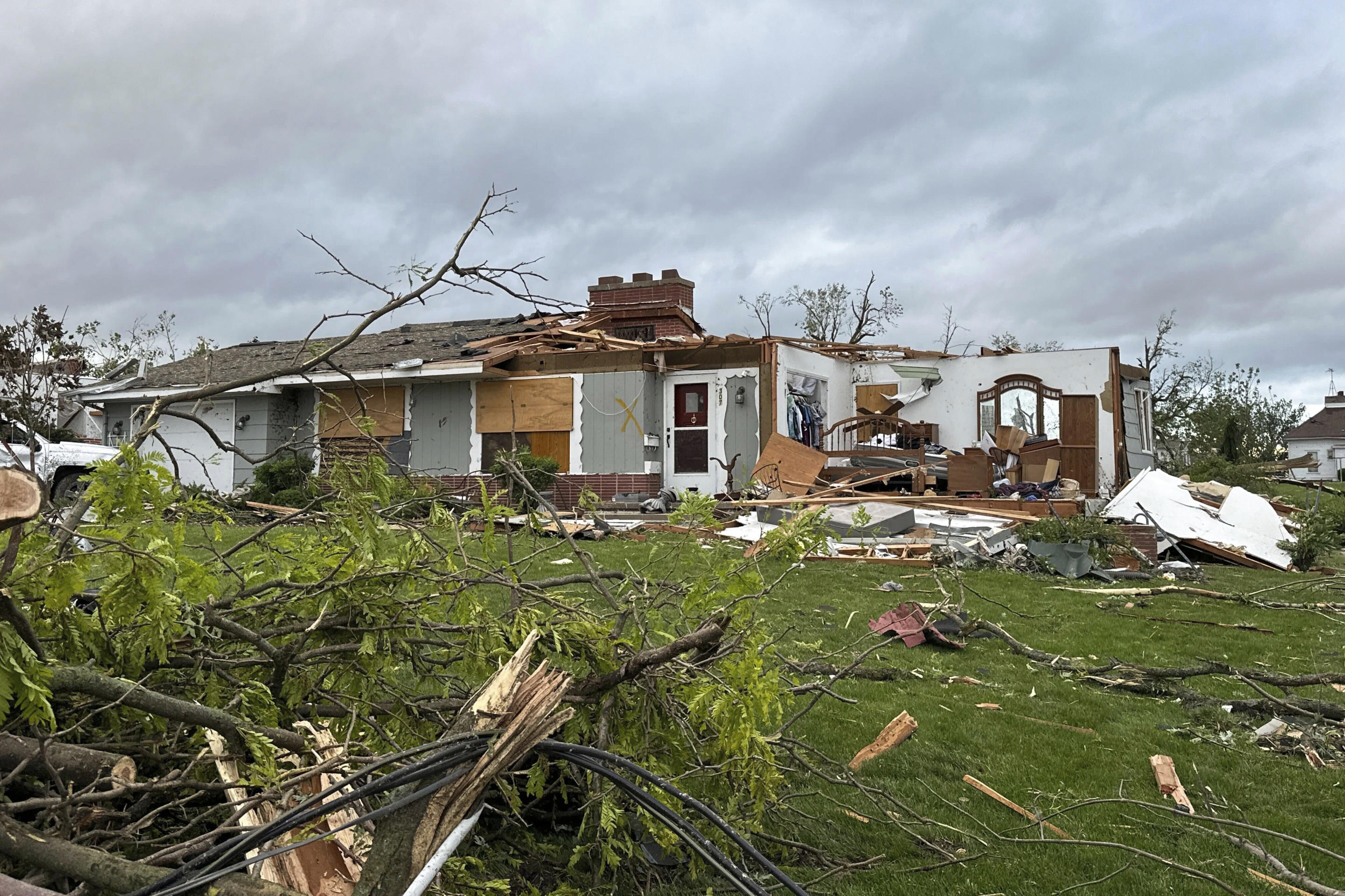 Damage to a home is seen after a tornado moved through Greenfield, Iowa, on Tuesday.