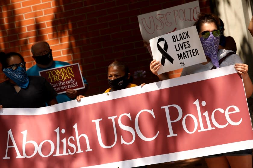 LOS ANGELES, CA - JUNE 30, 2020 - - Close to 40 students, community members, clergy, and labor allies protest in front of the USC Department of Public Safety demanding the university take immediate steps to abolish the USC police force and reinvest those funds in affordable housing for the surrounding community in Los Angeles on June 30, 2020. The coalition, led by Creating Justice, ACCE, USC Forward, and the Southern Christian Leadership Conference, is also calling for an end to restrictive campus security measures aimed at keeping local residents out of USC facilities, and a commitment by the university to recruit and admit at least 1,000 students annually from South Los Angeles and Boyle Heights, with full scholarships. The USC Department of Public Safety operates through an agreement with the Los Angeles Police Department, and is one of the largest campus police forces in the nation. USC administrators have done little to address over policing and racial profiling on campus, despite substantial judgments levied against the Department of Public Safety in recent years. The Department of Public Safety has struggled with over policing and racial profiling in recent years, including an incident in 2013, where over 100 officers in full riot gear, in coordination with LAPD, targeted an end-of-year party attended by predominately black and brown students. (Genaro Molina / Los Angeles Times)