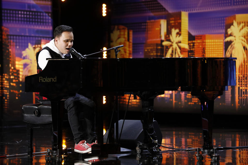 This Tuesday, May 28, 2019 photo provided by NBC shows Kodi Lee during his original audition performing on NBC's "America's Got Talent" in Pasadena, Calif. Lee singing a version of "A Song For You" has been viewed nearly 432 million times online, NBC said. (Trae Patton/NBC via AP)
