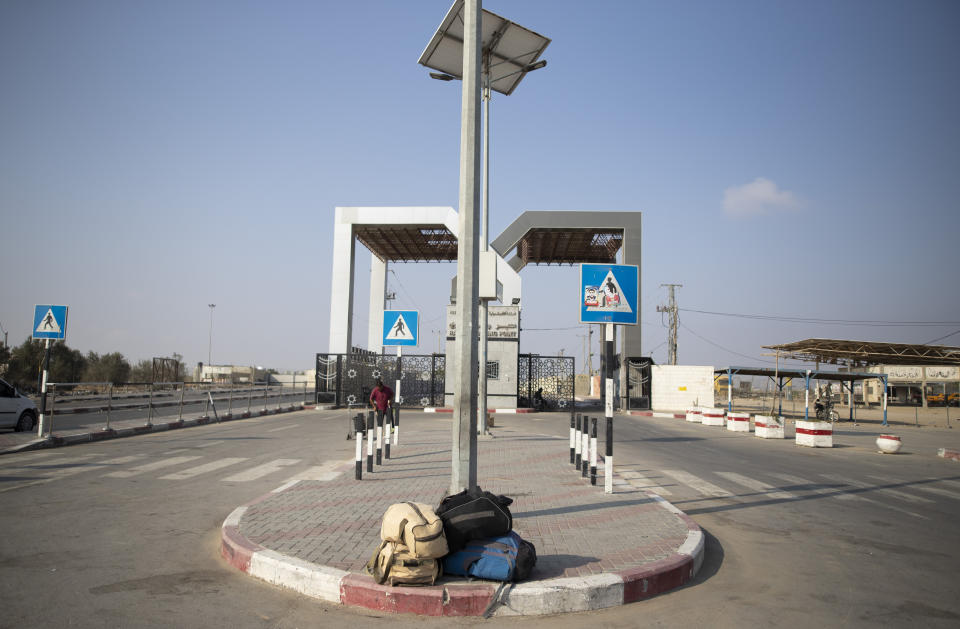 In this Thursday, Aug. 29, 2019, photo, luggage of Palestinian travelers on the ground in from of the main gate of the Rafag border crossing with Egypt, southern Gaza Strip. The death abroad of a Palestinian who fled the Gaza Strip seeking a better life in Europe has highlighted the exodus of thousands of middle-class residents in recent years. Tamer al-Sultan's friends and family say he fled the oppressive rule of Hamas. Others are leaving because of the dire conditions in the territory, which has been under an Israeli and Egyptian blockade since the Islamic militant group seized power 12 years ago. (AP Photo/Khalil Hamra)