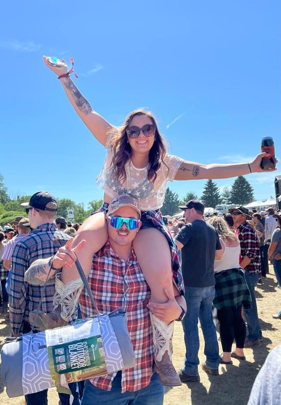 A concertgoer at Country Fest in Lawrence Township enjoys the Ernest concert on Saturday. Morgan Wallen's 10 p.m. show was expected to draw a record crowd of around 25,000.