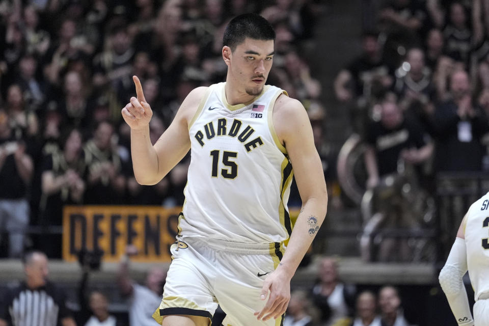 Purdue center Zach Edey (15) celebrates after a basket against Rutgers during the first half of an NCAA college basketball game in West Lafayette, Ind., Thursday, Feb. 22, 2024. (AP Photo/Michael Conroy)