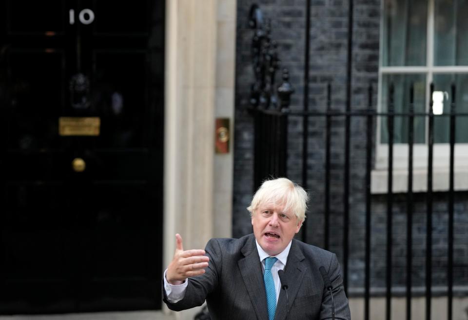 Outgoing British Prime Minister Boris Johnson gestures as he speaks outside Downing Street in London, Tuesday, Sept. 6, 2022 before heading to Balmoral in Scotland, where he will announce his resignation to Britain's Queen Elizabeth II. Later on Tuesday Liz Truss will formally become Britain's new Prime Minister after an audience with the Queen.