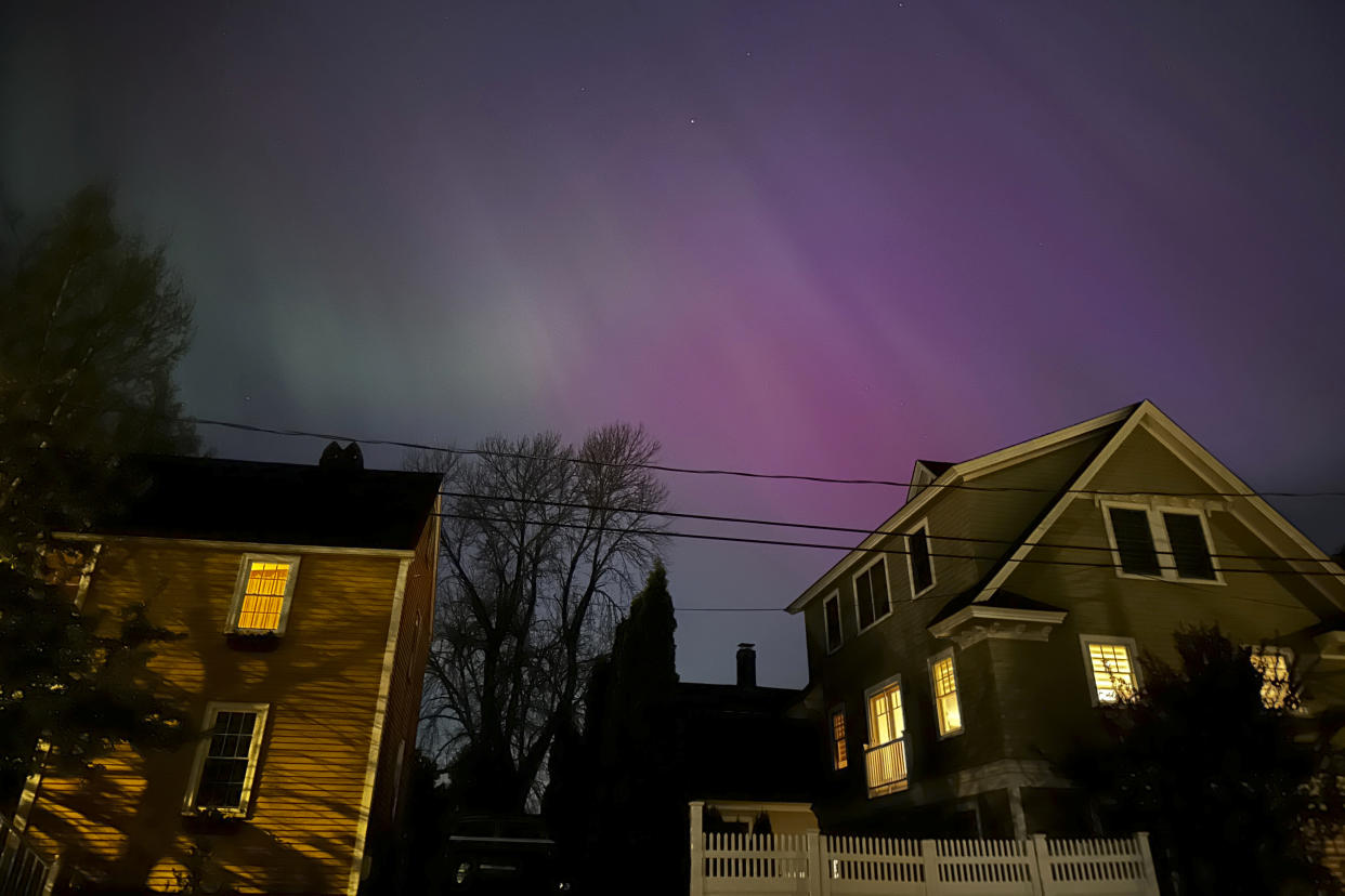 Northern lights shine over Portsmouth, N.H., Friday, May 10, 2024. (AP Photo/Caleb Jones)