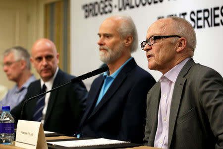 Nobel laureate Finn Kydland (R) speaks at a news conference in Beijing, China, May 7, 2016. REUTERS/Jason Lee