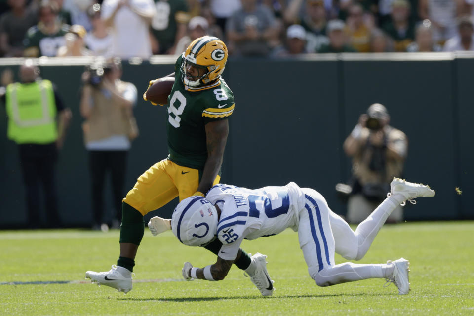 Green Bay Packers running back Josh Jacobs (8) is stopped by Indianapolis Colts safety Rodney Thomas II (25) during the first half of an NFL football game Sunday, Sept. 15, 2024, in Green Bay, Wis. (AP Photo/Matt Ludtke)