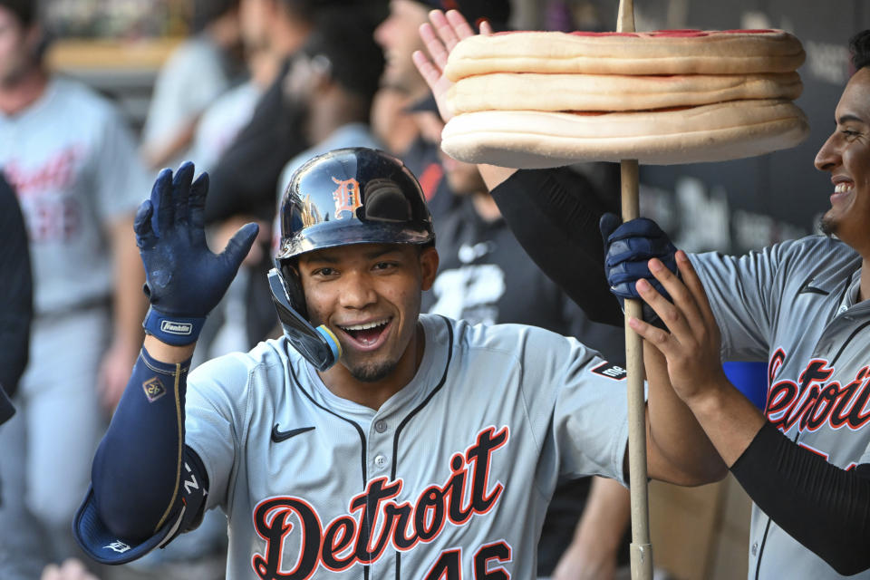 Detroit Tigers right fielder Wenceel Perez (46) celebrates in the dugout after hitting a home run against the Minnesota Twins during the third inning of a baseball game Wednesday, July 3, 2024, in Minneapolis. (AP Photo/Craig Lassig)
