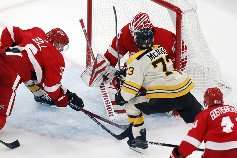 Boston Bruins' Charlie McAvoy (73) scores on Detroit Red Wings goalie Ville Husso during the first period of an NHL hockey game Saturday, Oct. 28, 2023, in Boston. (AP Photo/Michael Dwyer)