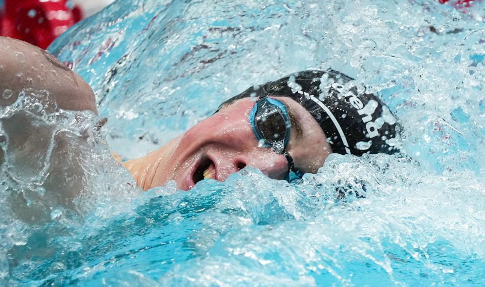 Carmel Aaron Shackell competes in the 200 yard freestyle swim during the IHSAA swimming and diving state finals on Saturday, Feb. 25, 2023 at IIUPUI Natatorium in Indianapolis. 
