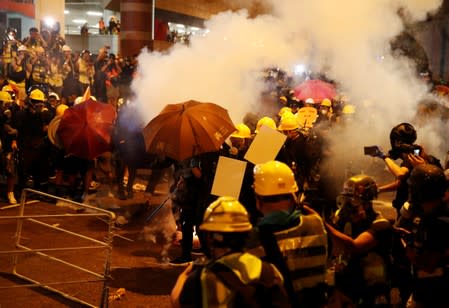 Anti-extradition demonstrators are seen a barricade, after a march to call for democratic reforms in Hong Kong