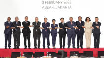 From left to right; Malaysian Foreign Minister Zambry Abdul Kadir, Philippine's Foreign Secretary Enrique Manalo, Singaporean Foreign Minister Vivian Balakrishnan, Thailand's Foreign Minister Don Pramudwinai, Vietnam's Foreign Minister Bui Thanh Son, Indonesian Foreign Minister Retno Marsudi, Laotian Foreign Minister Saleumxay Kommasith, Brunei's Second Minister of Foreign Affair Erywan Yusof, Cambodia's Foreign Minister Prak Sokhonn, East Timor's Foreign Minister Adaljiza Magno and ASEAN Secretary General Kao Kim Hourn hold hands as they pose for a group photo during the Association of Southeast Asian Nations (ASEAN) Coordinating Council Meeting at the ASEAN Secretariat in Jakarta, Indonesia, Friday, Feb. 3, 2023. Southeast Asian foreign ministers are meeting in Indonesia's capital Friday for talks bound to be dominated by the deteriorating situation in Myanmar despite an agenda focused on food and energy security and cooperation in finance and health. (AP Photo/Achmad Ibrahim)