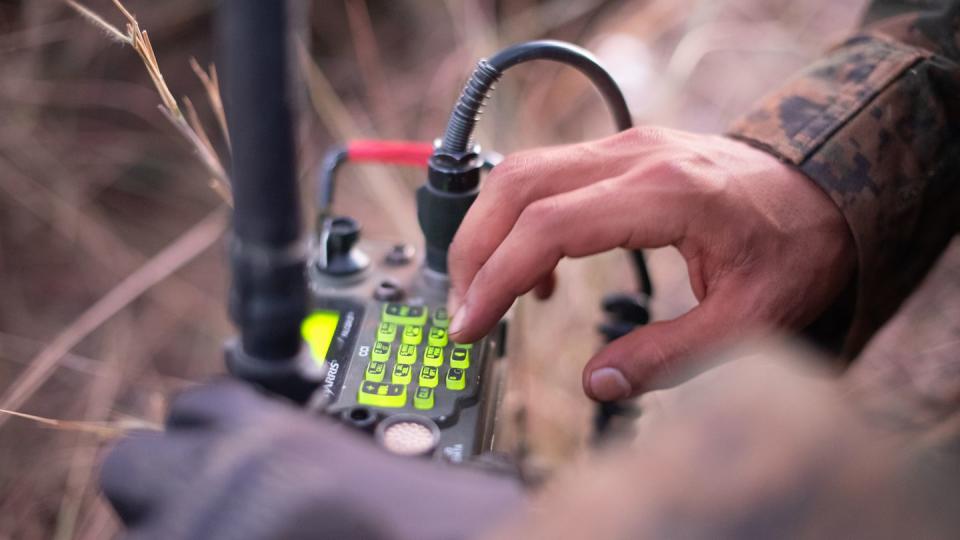 Marines operate the radio to establish communications with the surrounding squads during defensive tactics training, Aug. 6, at the Base Expedicionaria de Fuzileiros Navais in Formosa, Brazil, during the annual Infantry Training Exercise Formosa. (Gunnery Sgt. Daniel Wetzel/Marine Corps)