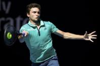 France's Gilles Simon hits a shot during his fourth round match against Serbia's Novak Djokovic at the Australian Open tennis tournament at Melbourne Park, Australia, January 24, 2016. REUTERS/Issei Kato