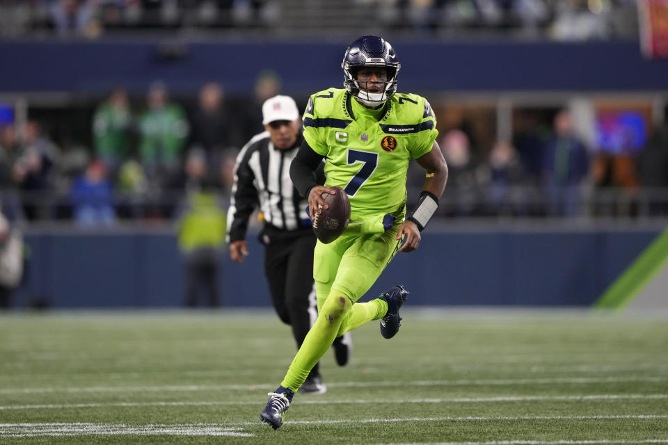 Seattle Seahawks quarterback Geno Smith scrambles during the second half of an NFL football game against the San Francisco 49ers, Thursday, Nov. 23, 2023, in Seattle. (AP Photo/Lindsey Wasson)