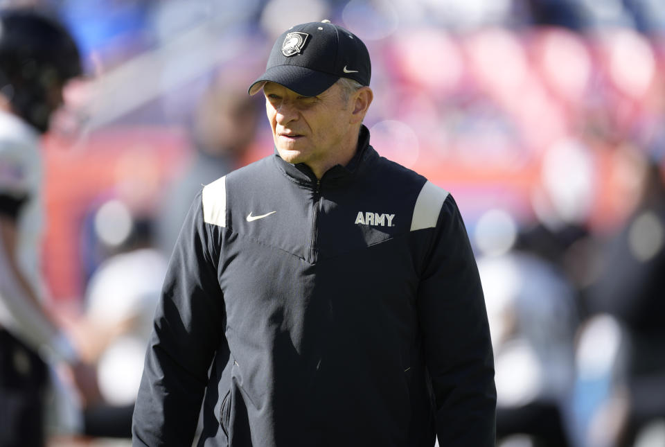 Army head coach Jeff Monken looks on as players warm up before an NCAA college football game against Air Force on Saturday, Nov. 4, 2023, in Denver. (AP Photo/David Zalubowski)